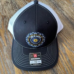 Richardson Black & White Trucker Hat with Blue-Yellow Crest